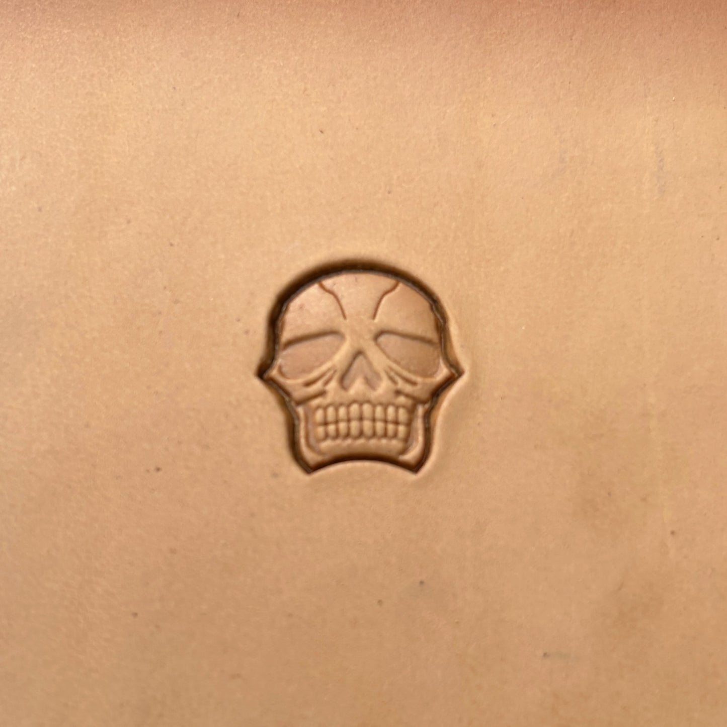 Stacked Skull leather stamp LT338 — single impression on veg-tan leather