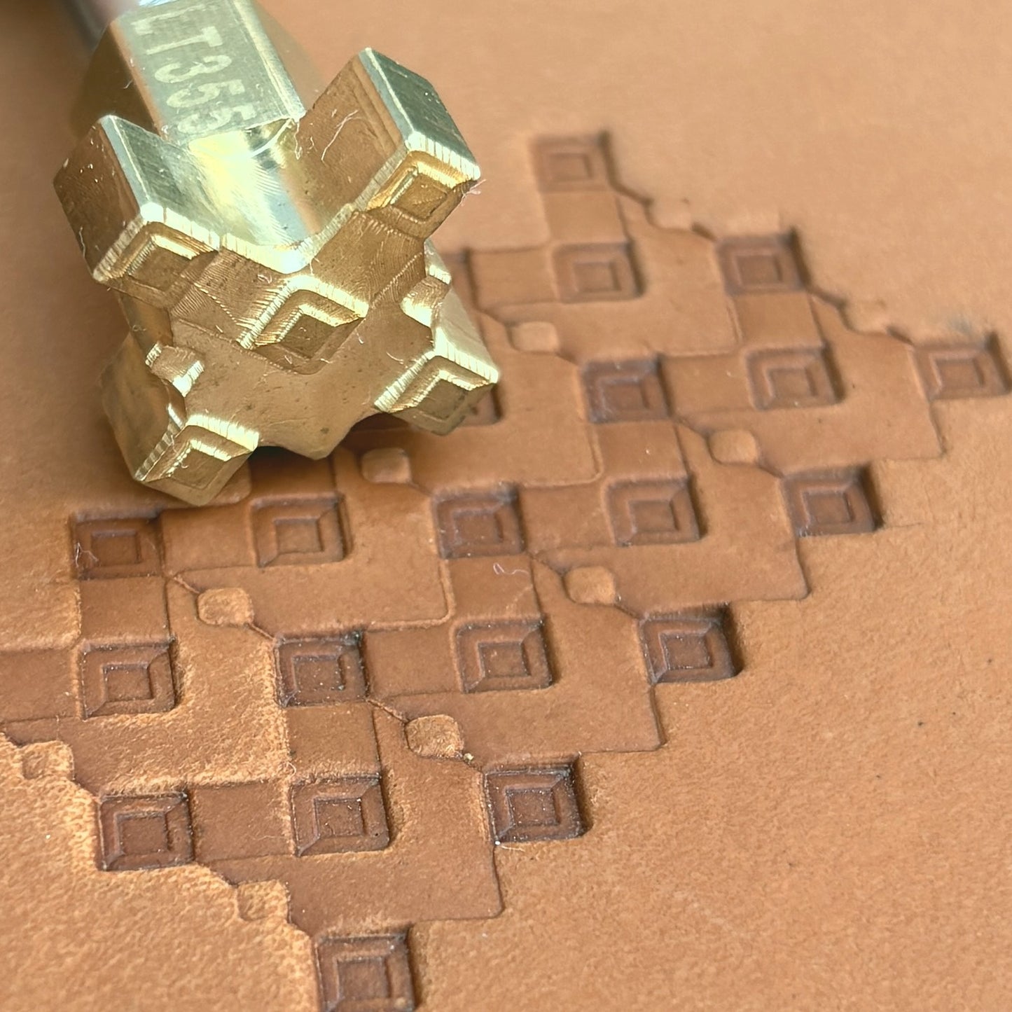 Geometric leather stamp LT355 — brass stamping tool with imprint on natural veg-tan leather