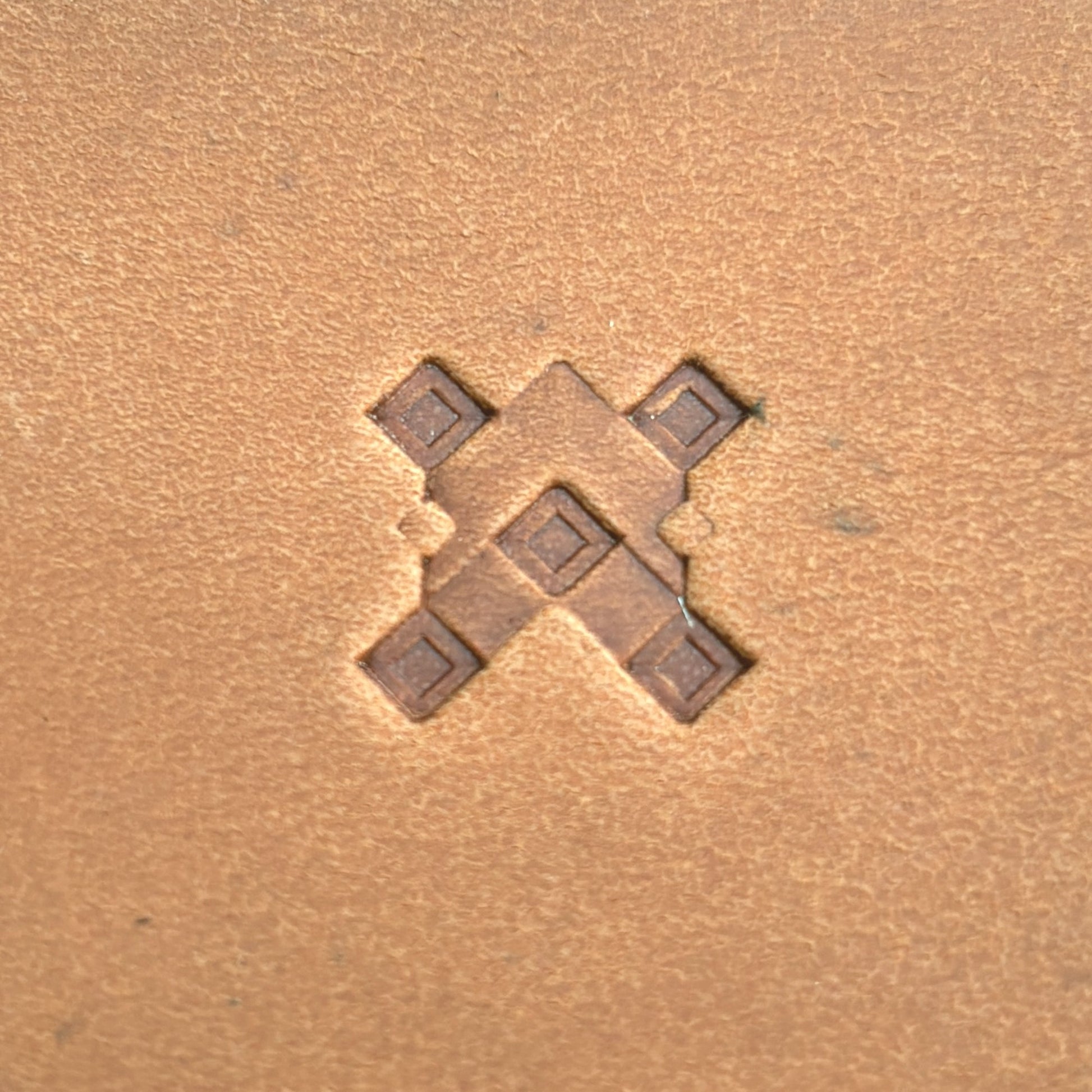 Geometric leather stamp LT355 — single impression on veg-tan leather