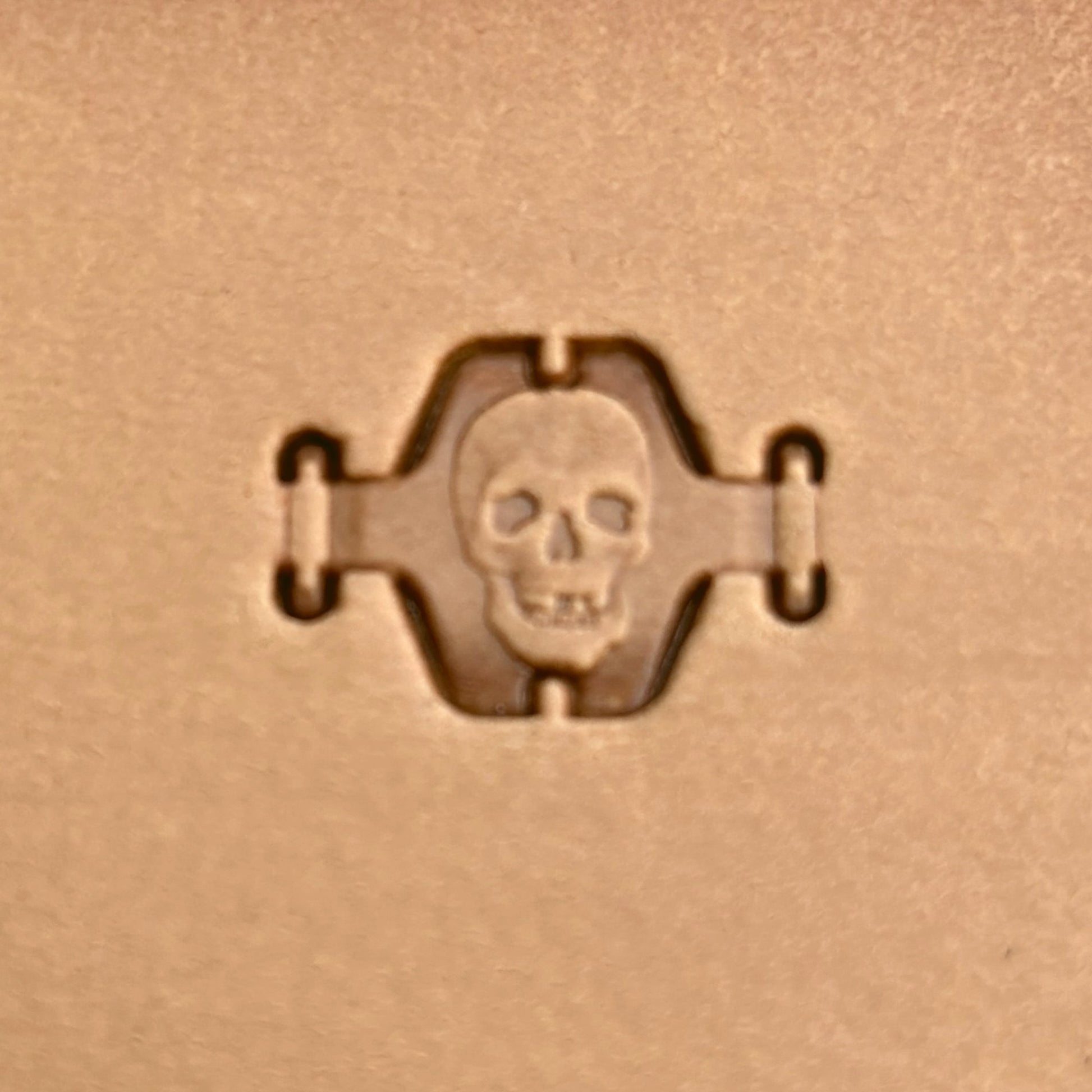 Skull leather stamp LT358 — single impression on veg-tan leather