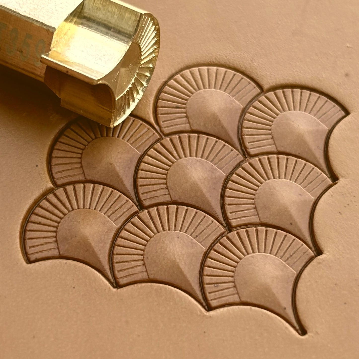 Geometric leather stamp LT359 — brass stamping tool with imprint on natural veg-tan leather