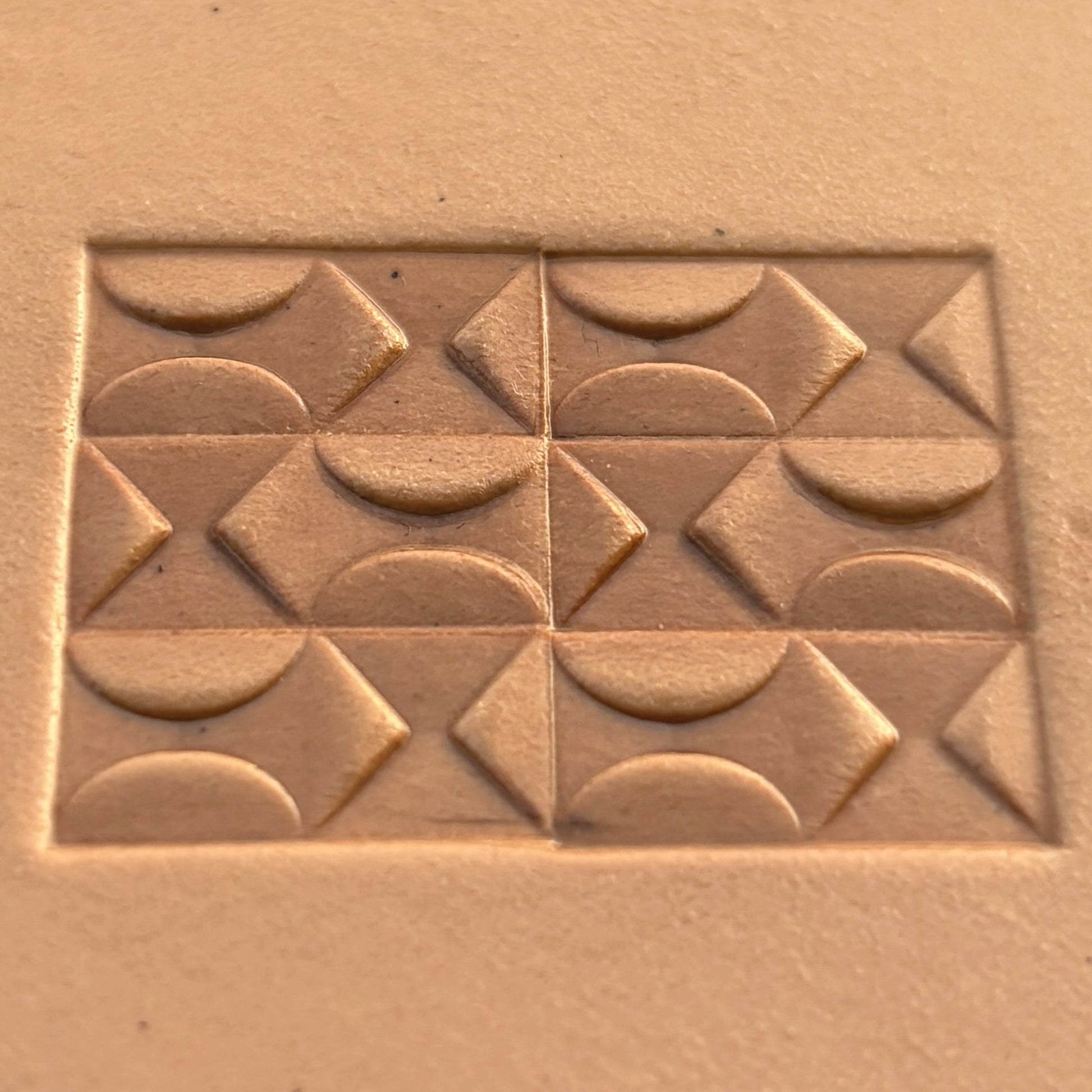 Geometric leather stamp LT360 — brass stamping tool with imprint on natural veg-tan leather