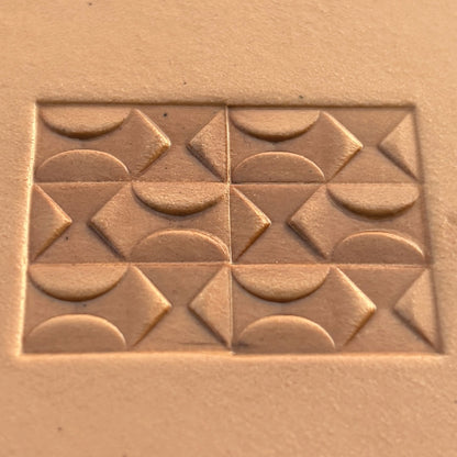 Geometric leather stamp LT360 — brass stamping tool with imprint on natural veg-tan leather