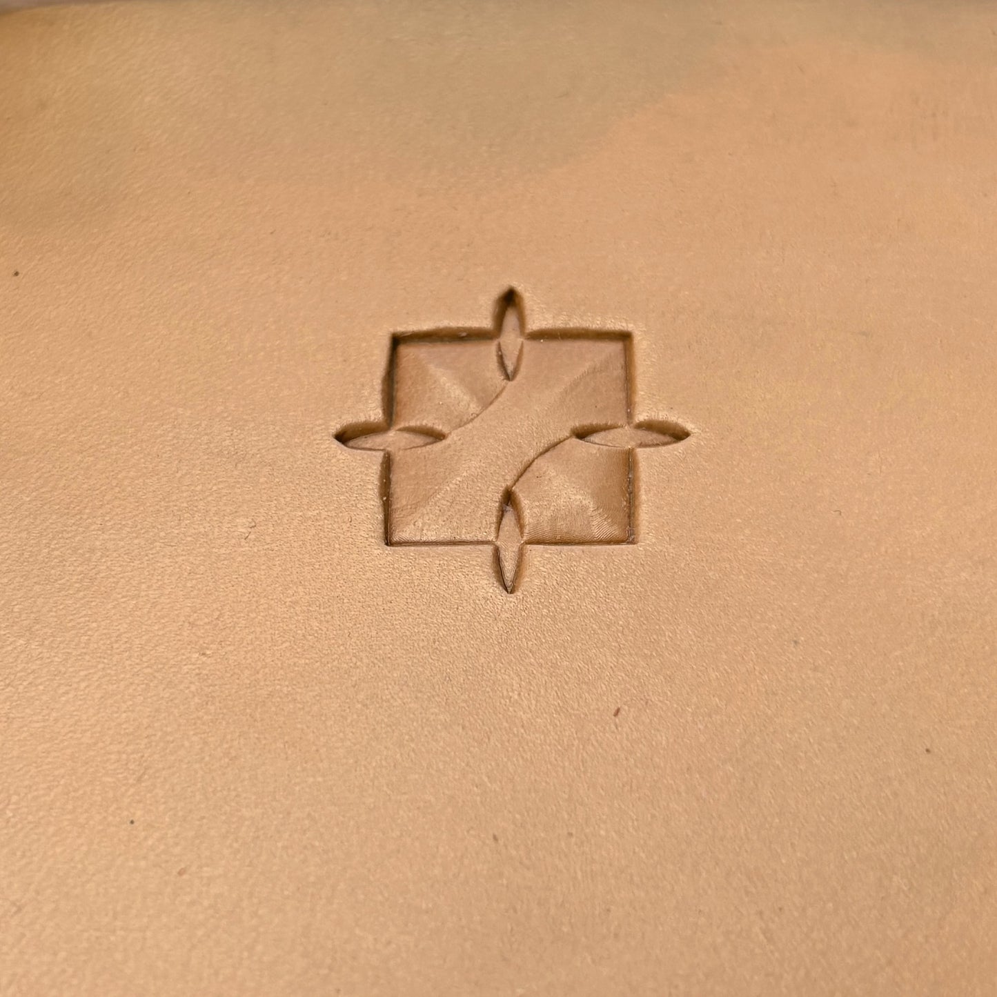 Interlock Geometric leather stamp LT376 — single impression on veg-tan leather