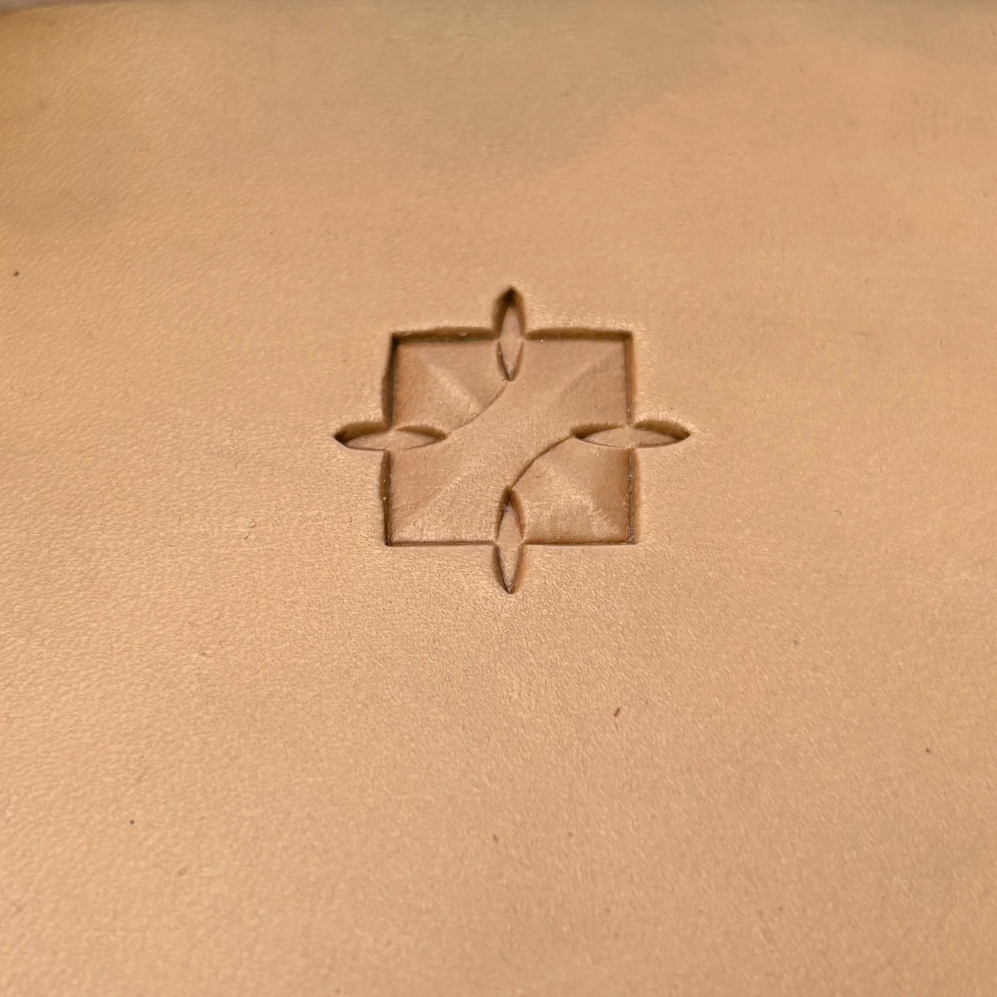 Interlock Geometric leather stamp LT376 — single impression on veg-tan leather