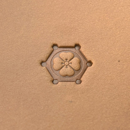 Floral Hexagon leather stamp LT377 — single impression on veg-tan leather