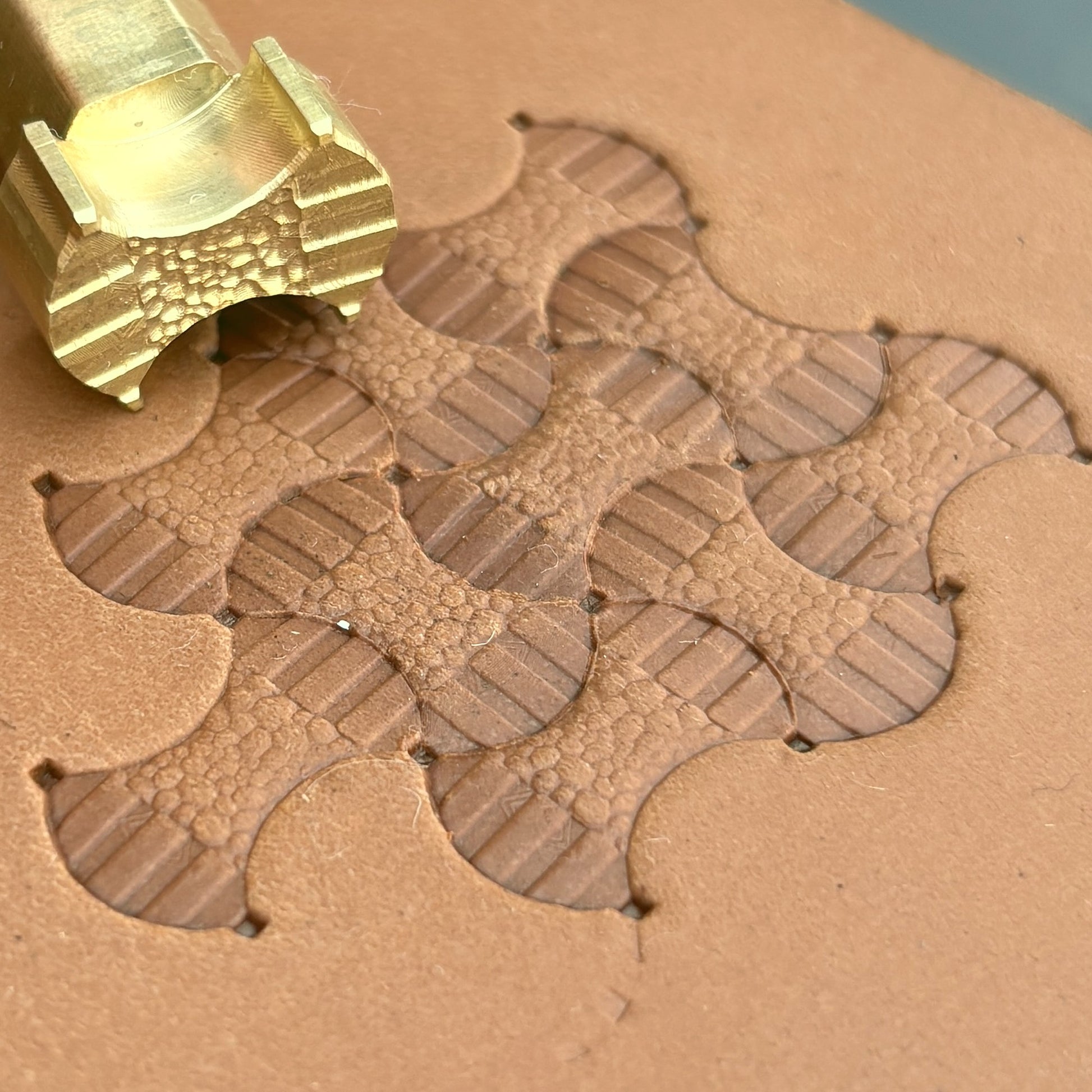 Geometric leather stamp LT381 — brass stamping tool with imprint on natural veg-tan leather