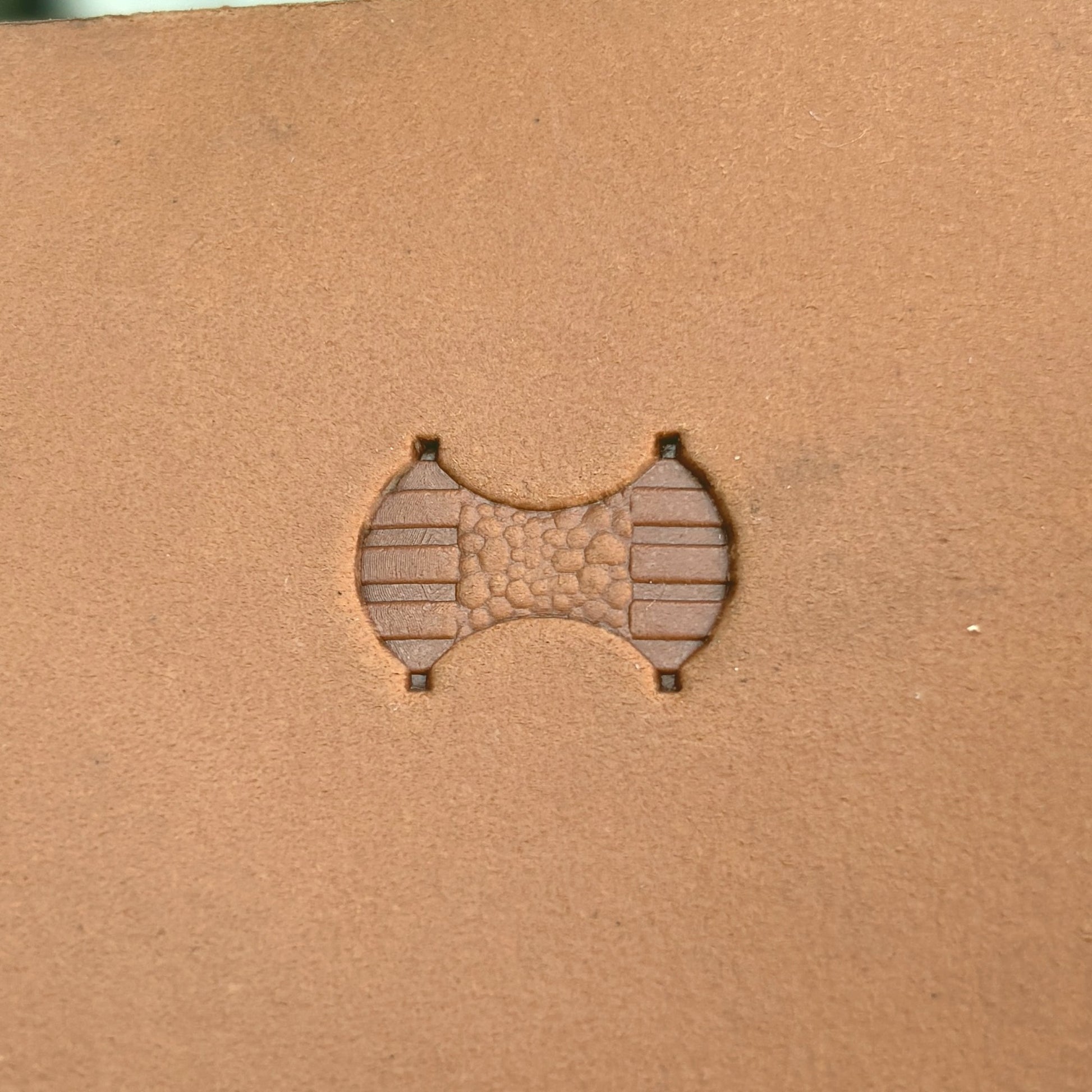 Geometric leather stamp LT381 — single impression on veg-tan leather