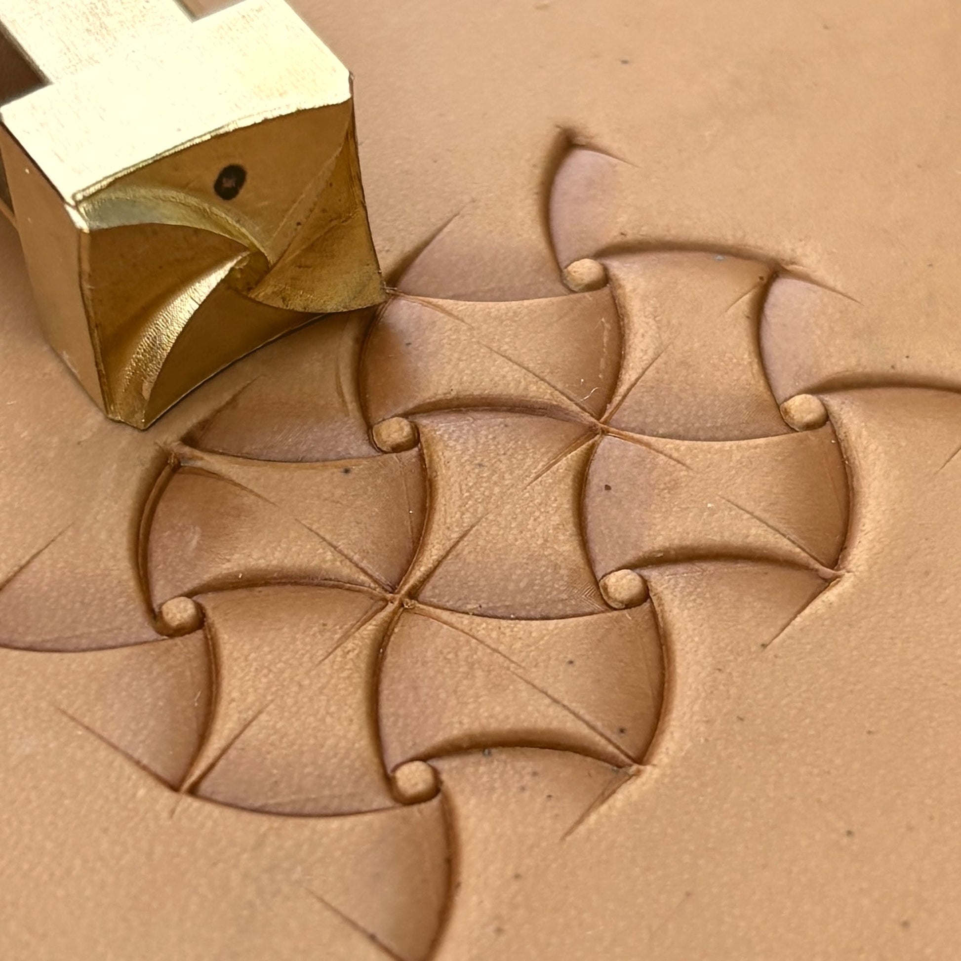 Pinwheel Design Geometric leather stamp LT383 — brass stamping tool with imprint on natural veg-tan leather