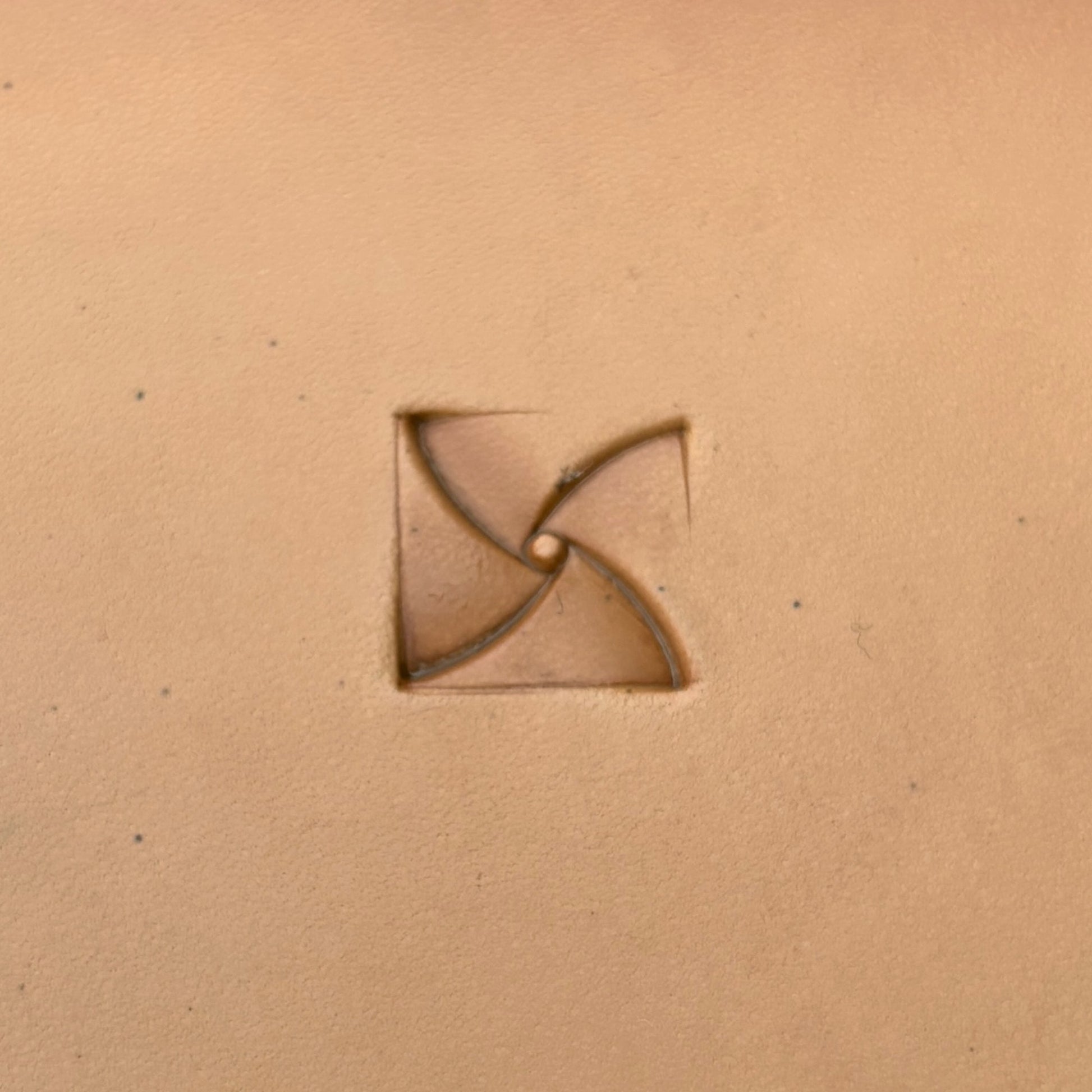 Pinwheel Design Geometric leather stamp LT383 — single impression on veg-tan leather