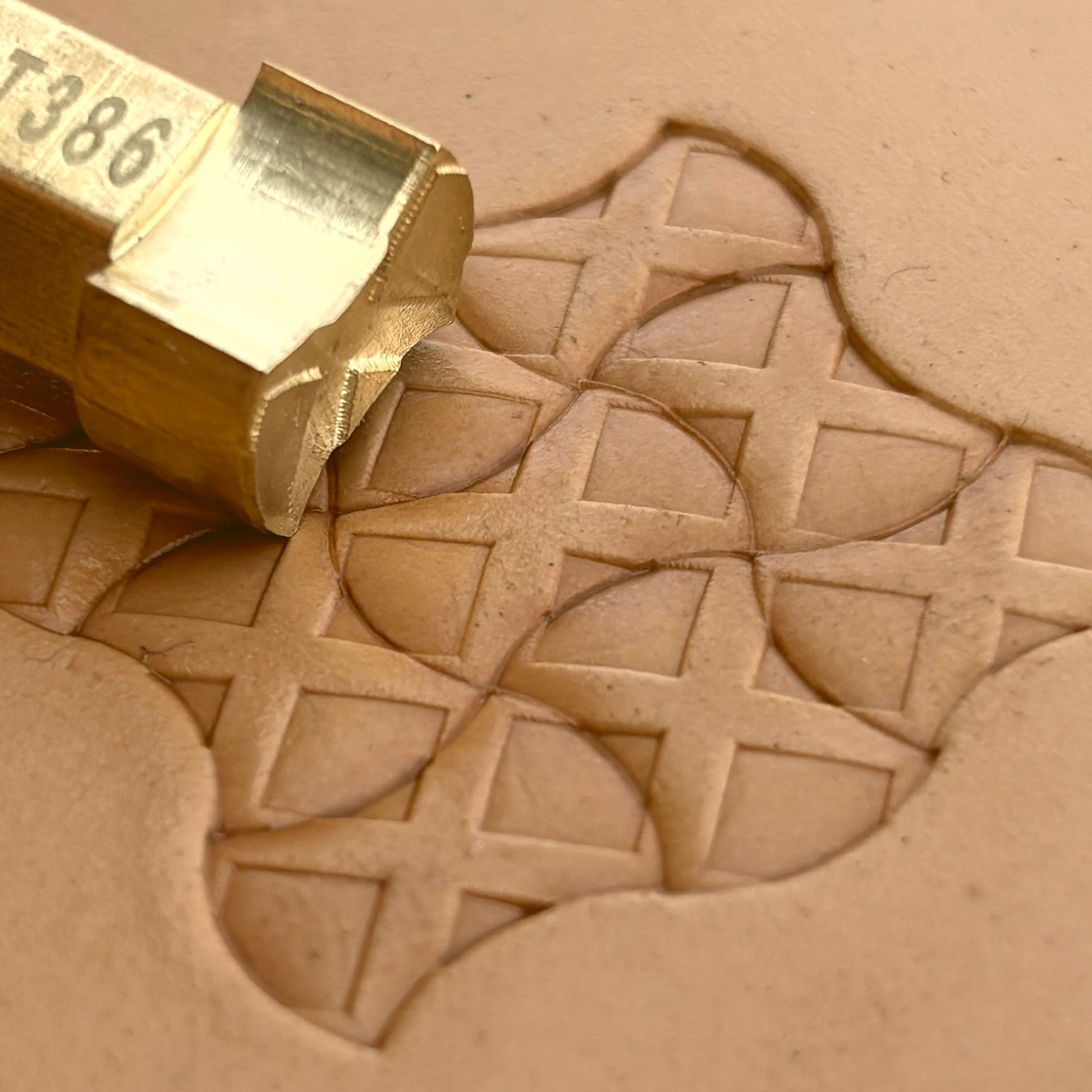 Geometric leather stamp LT386 — brass stamping tool with imprint on natural veg-tan leather