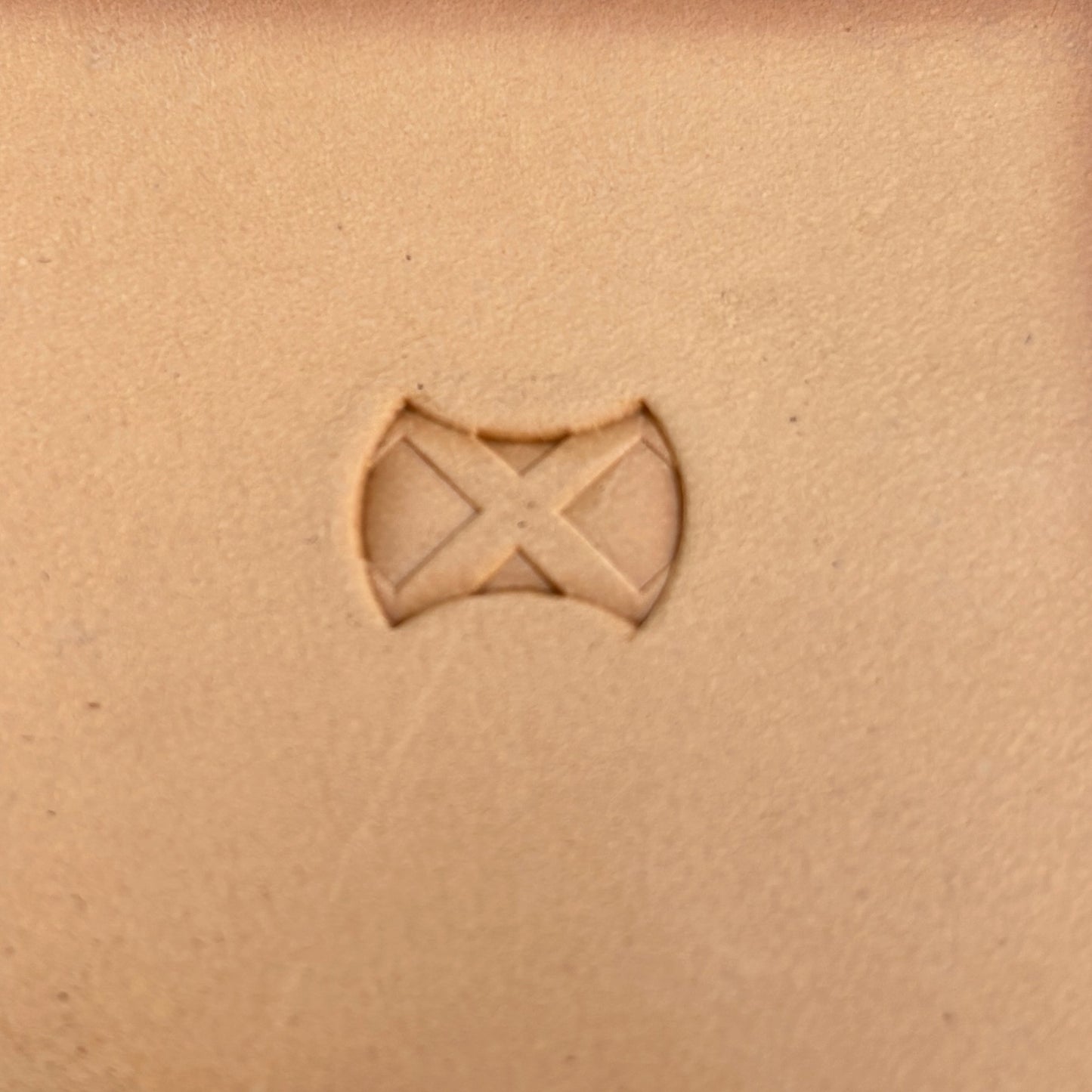 Geometric leather stamp LT386 — single impression on veg-tan leather