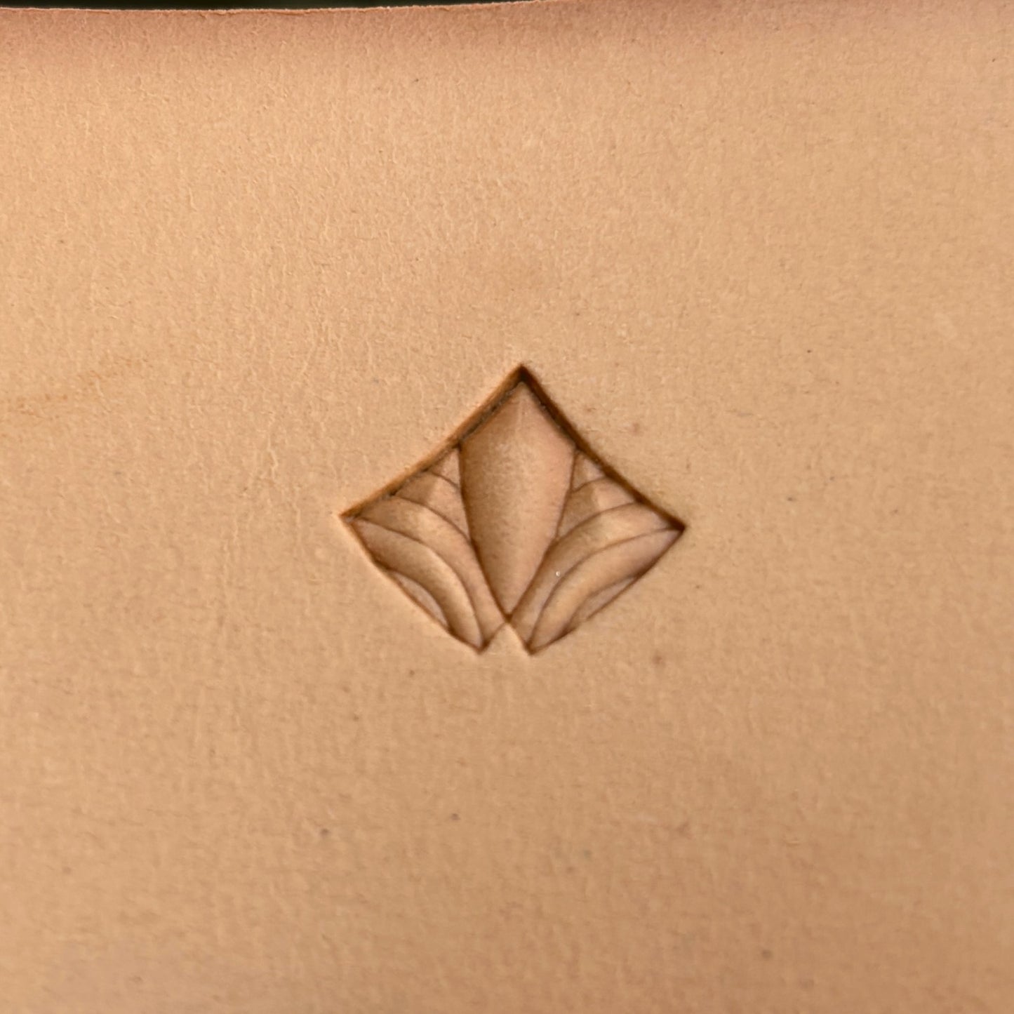 Geometric leather stamp LT390 — single impression on veg-tan leather