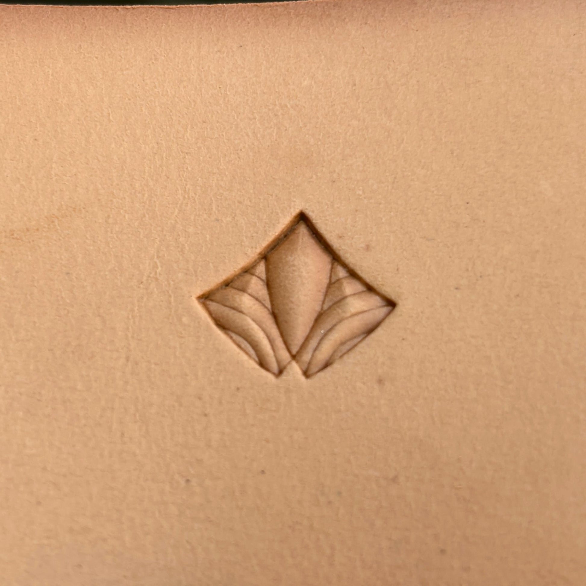 Geometric leather stamp LT390 — single impression on veg-tan leather
