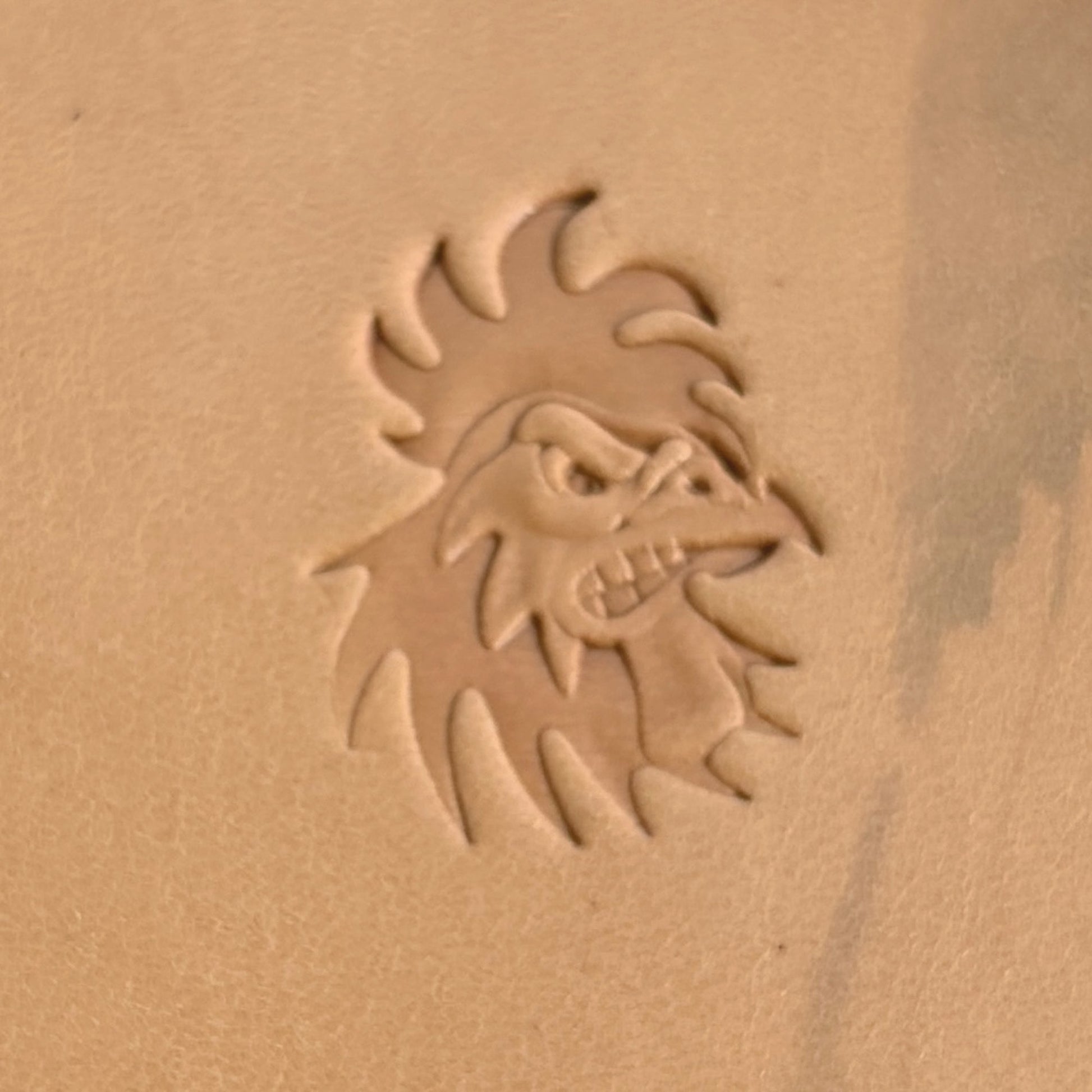 Fierce Rooster Head leather stamp LT393 — single impression on veg-tan leather