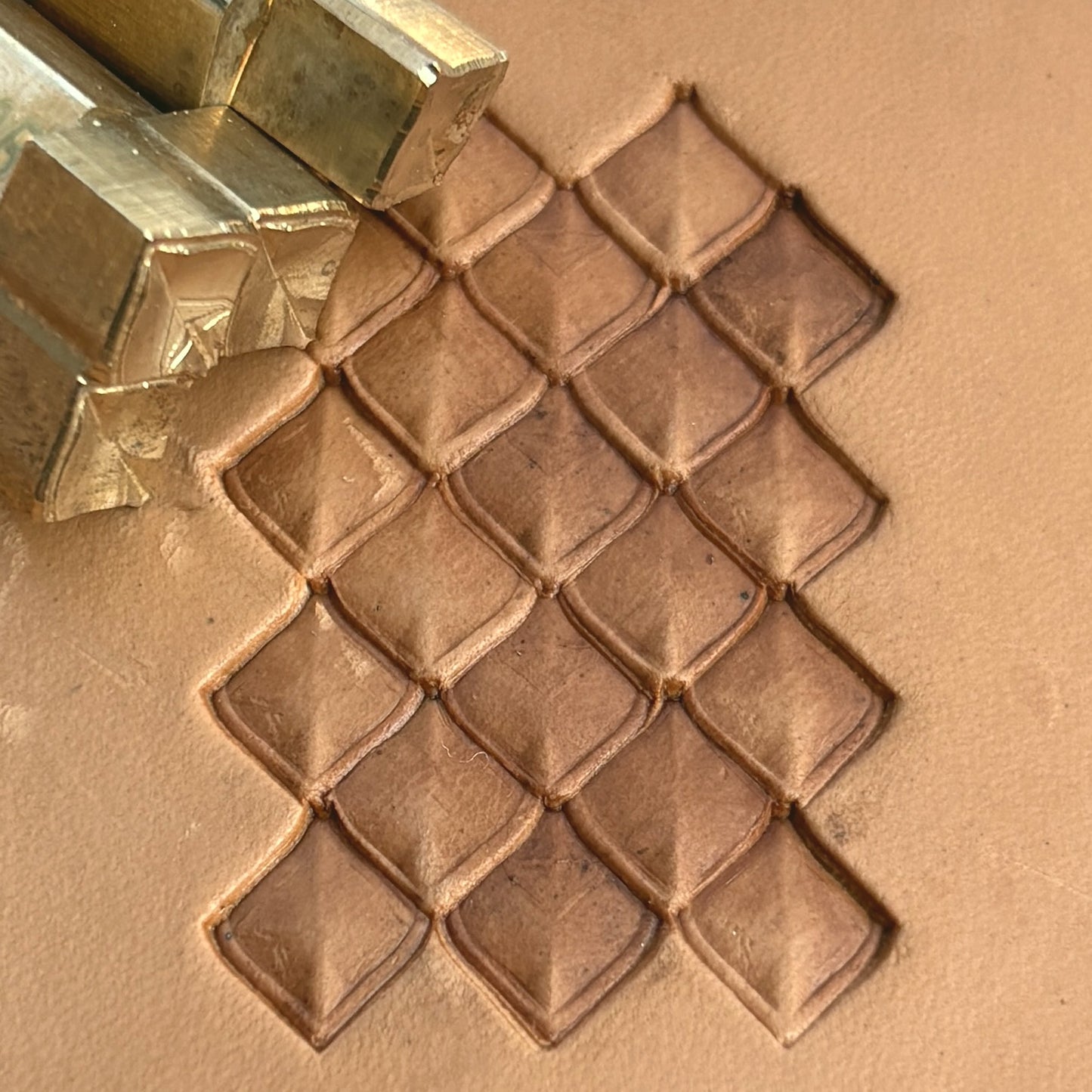 Geometric leather stamp LT402 — brass stamping tool with imprint on natural veg-tan leather