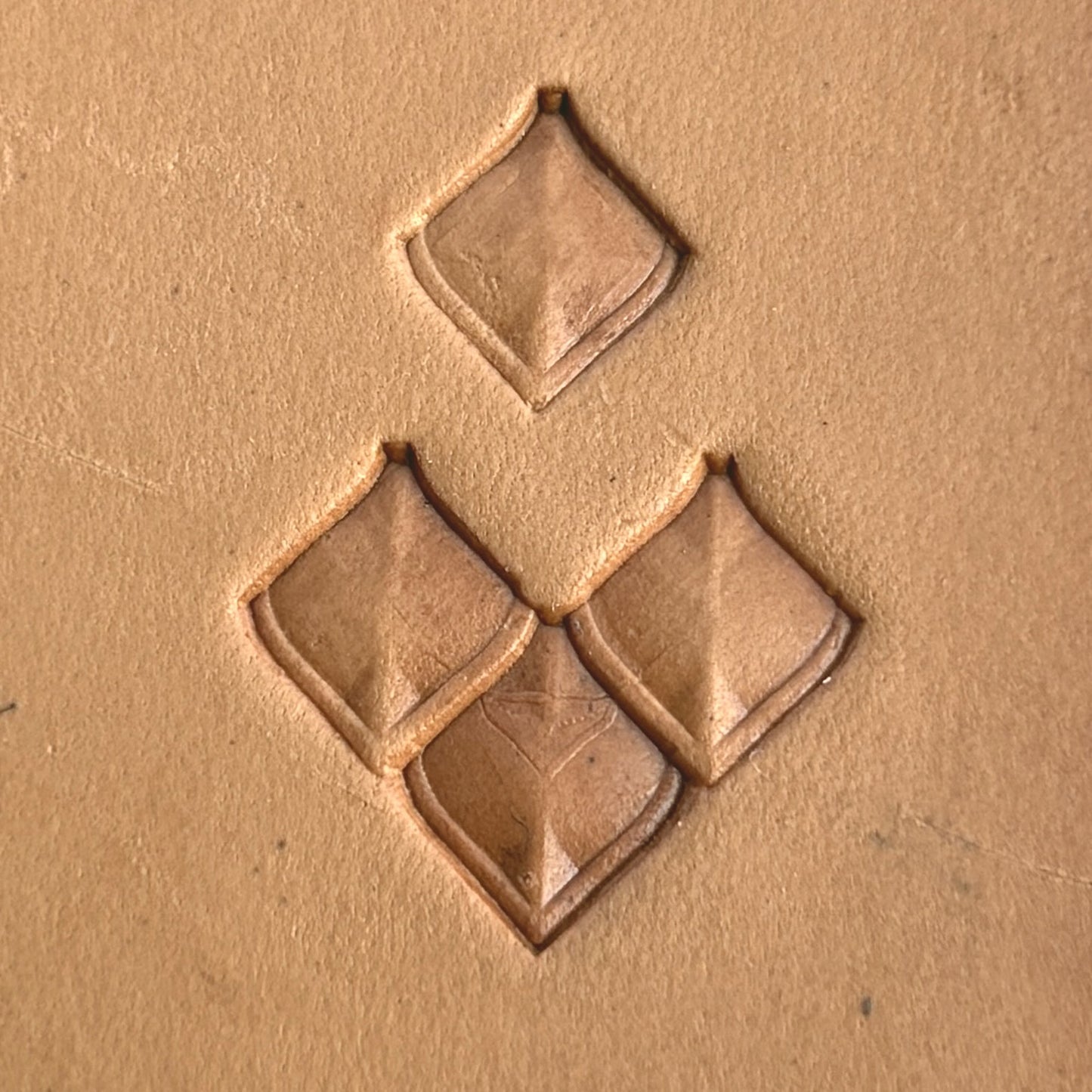 Geometric leather stamp LT402 — single impression on veg-tan leather