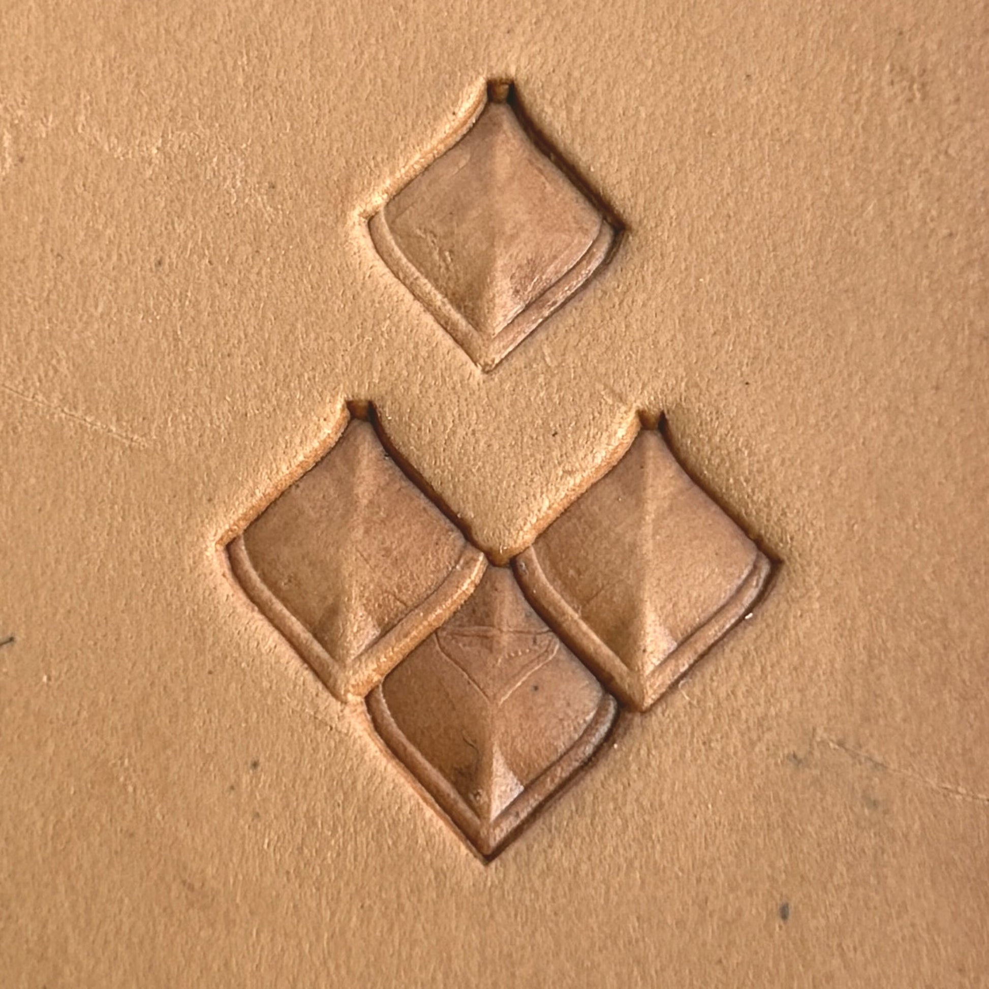 Geometric leather stamp LT402 — single impression on veg-tan leather