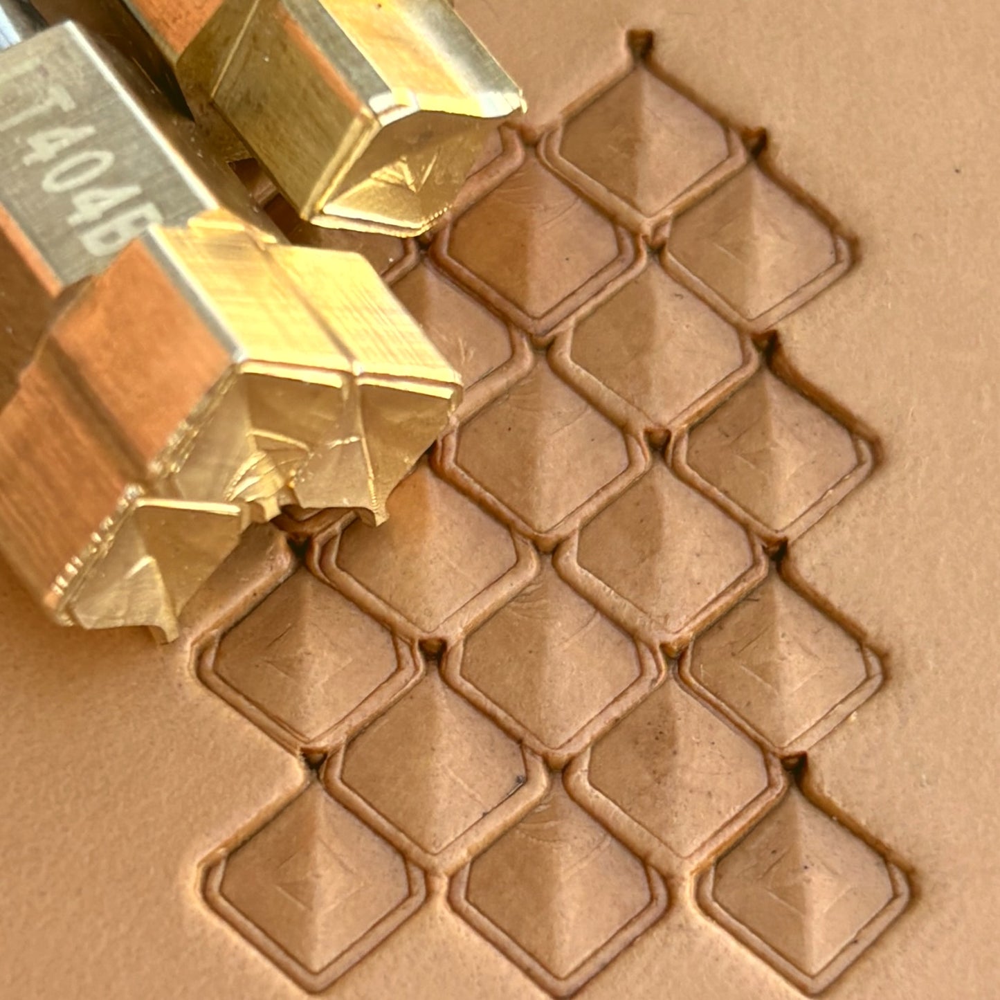 Geometric leather stamp LT404 — brass stamping tool with imprint on natural veg-tan leather