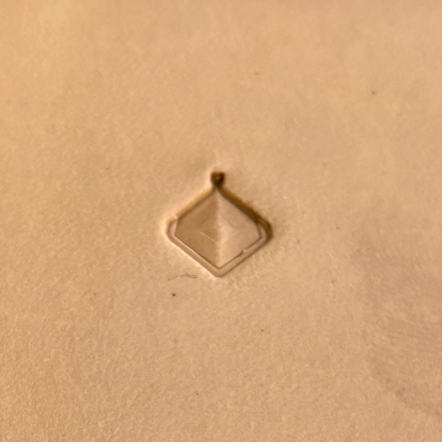 Geometric leather stamp LT404 — pattern imprint on veg-tan leather