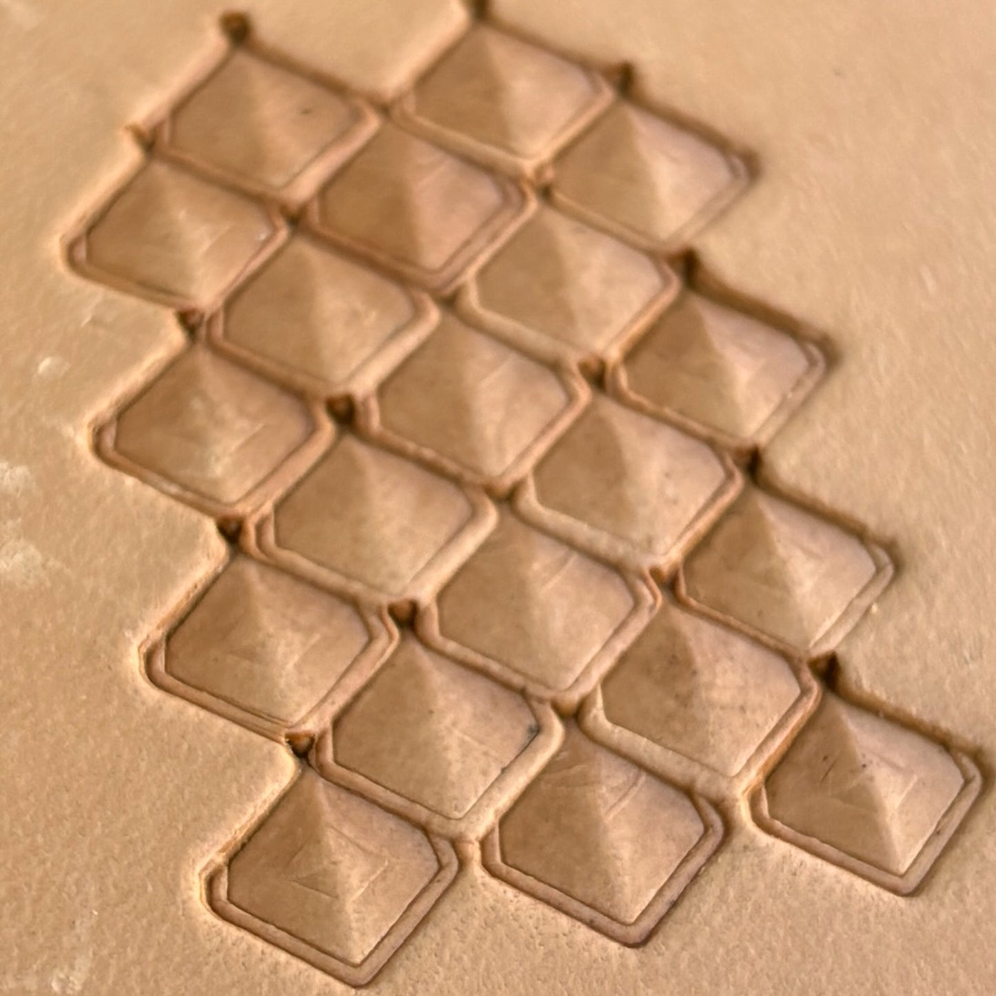 Geometric leather stamp LT404 — single impression on veg-tan leather