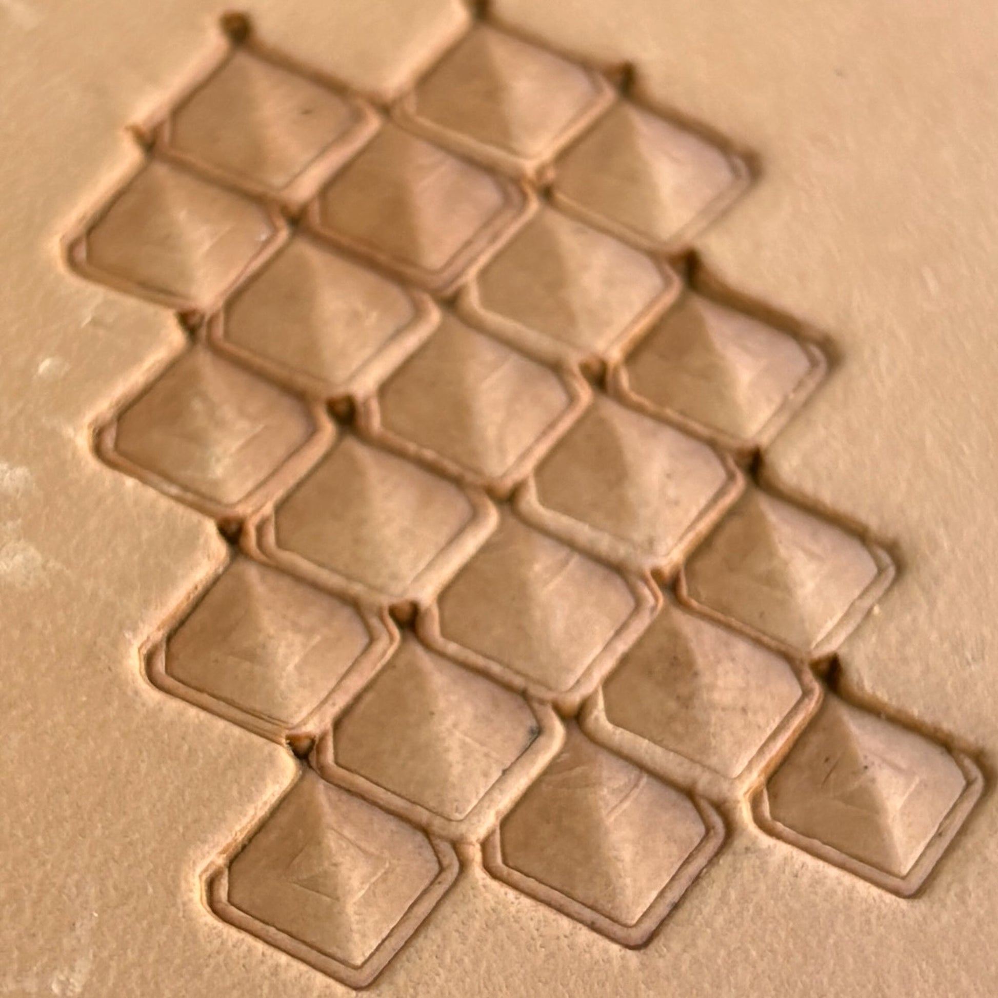 Geometric leather stamp LT404 — single impression on veg-tan leather