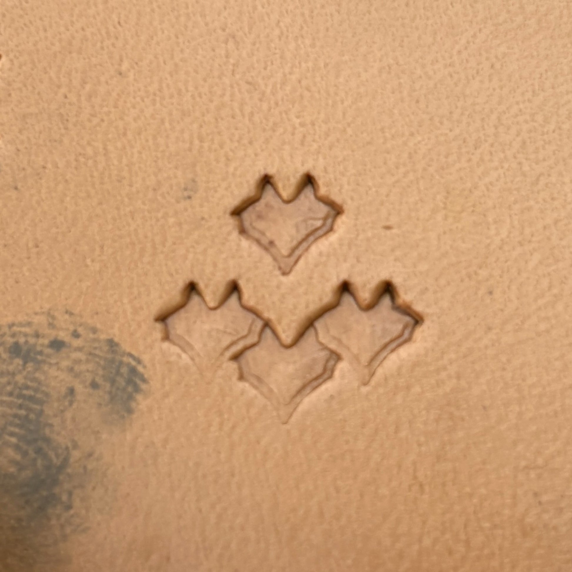 Scallop Scale leather stamp LT412 — single impression on veg-tan leather