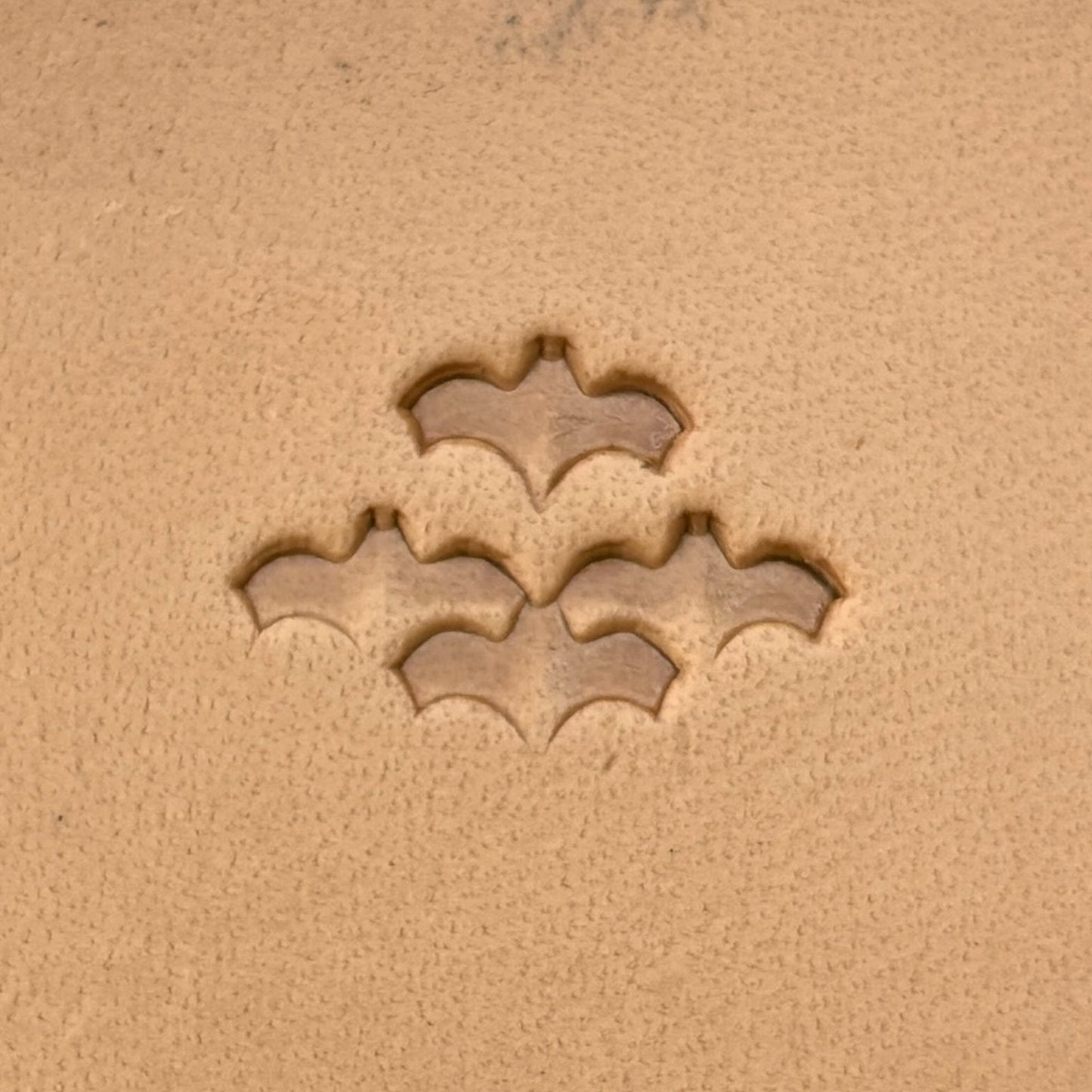 Scale Motif Bat leather stamp LT413 — single impression on veg-tan leather