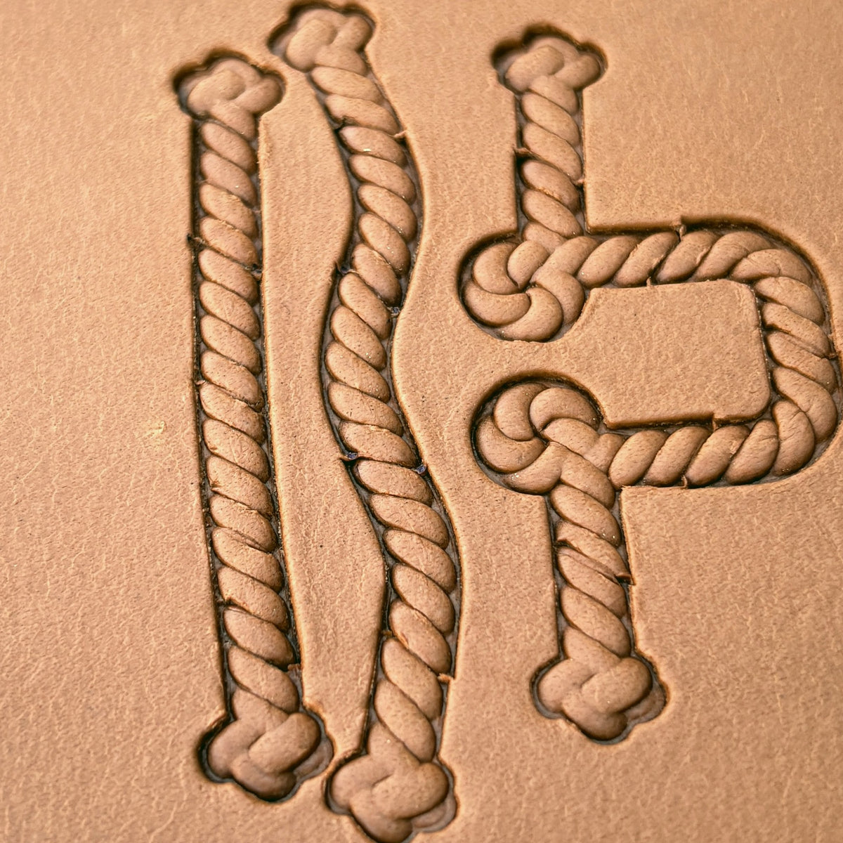 Knotted Rope leather stamp set LT424, straight runs, corners and ends combined into a border on leather