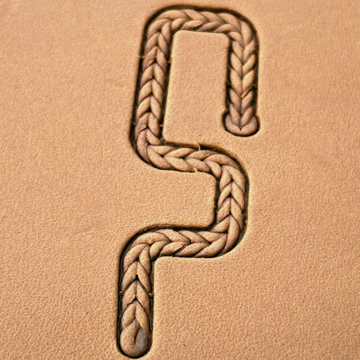 Fine Herringbone Braid leather stamp set LT426, straight runs, corners and ends combined into a border on leather