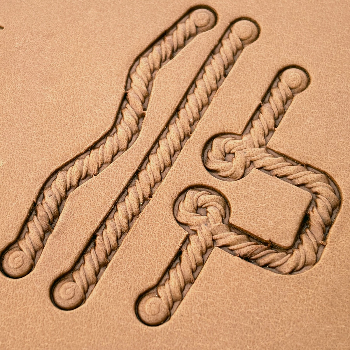 Coiled-End Rope leather stamp set LT428, straight runs, corners and ends combined into a border on leather