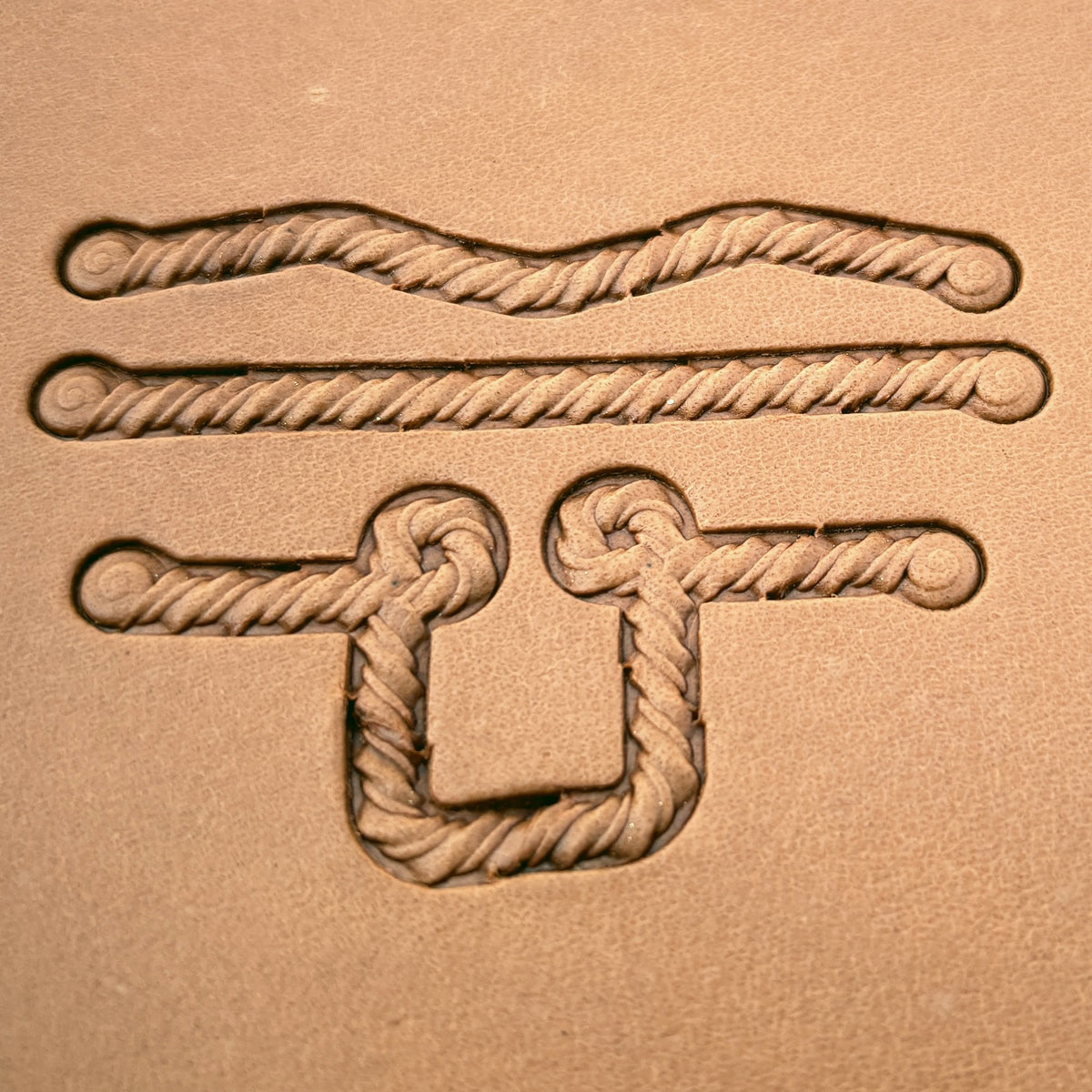 Coiled-End Rope leather stamp set LT428, straight runs, corners and ends combined into a border on leather