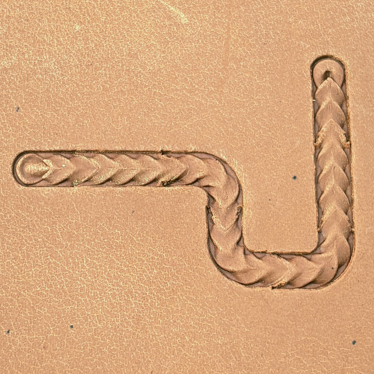 Wide Herringbone Braid leather stamp set LT429, straight runs, corners and ends combined into a border on leather