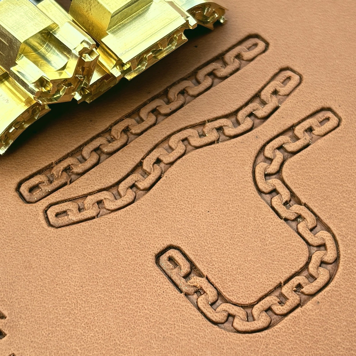 Box Link Chain leather stamp set LT431, brass stamps shown with their impressions on leather
