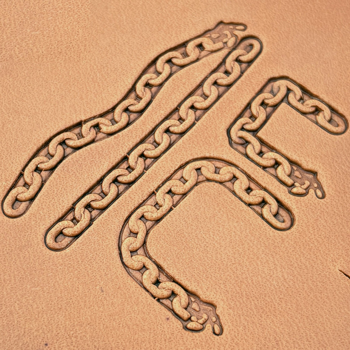 Oval Link Chain leather stamp set LT432, straight runs, corners and ends combined into a border on leather