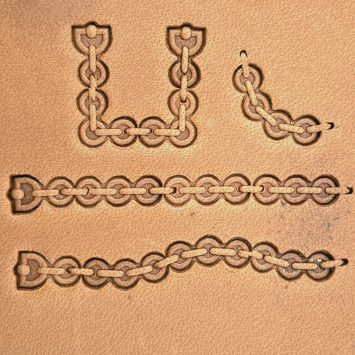 Round Link Chain leather stamp set LT433, straight runs, corners and ends combined into a border on leather
