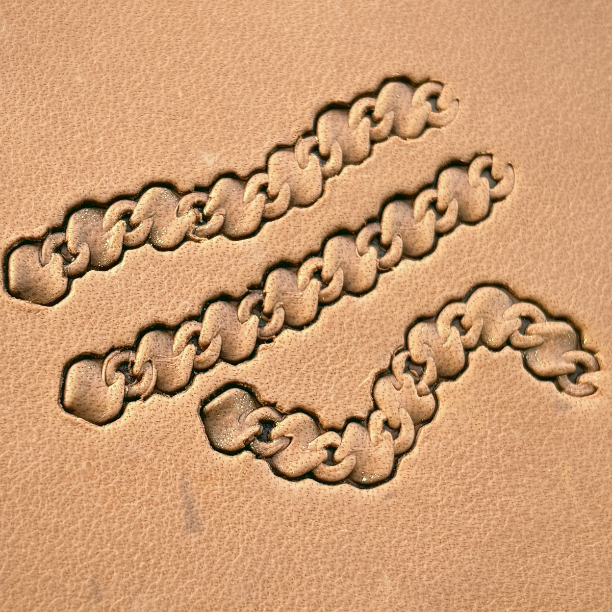 Heavy Curb Chain leather stamp set LT439, straight runs, corners and ends combined into a border on leather