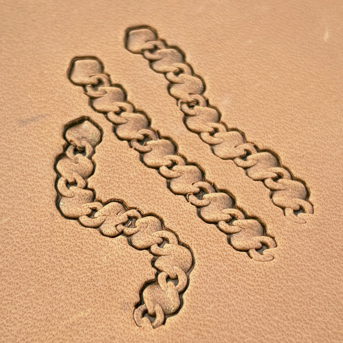 Heavy Curb Chain leather stamp set LT439, straight runs, corners and ends combined into a border on leather