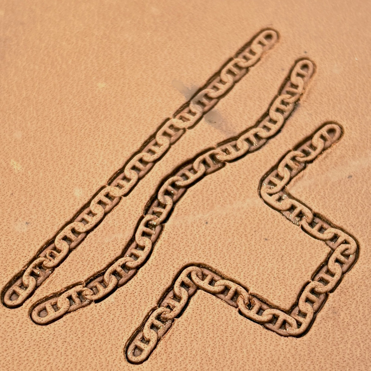 Mariner Chain leather stamp set LT441, straight runs, corners and ends combined into a border on leather