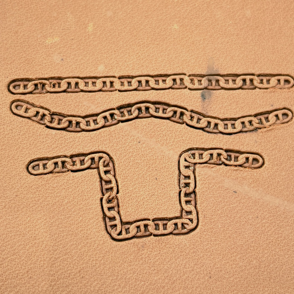 Mariner Chain leather stamp set LT441, straight runs, corners and ends combined into a border on leather