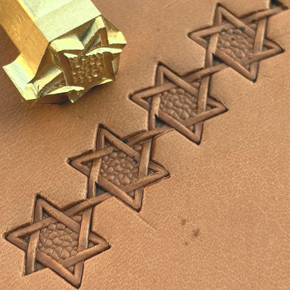 Interwoven Star Geometric leather stamp LT515 — brass stamping tool with imprint on natural veg-tan leather