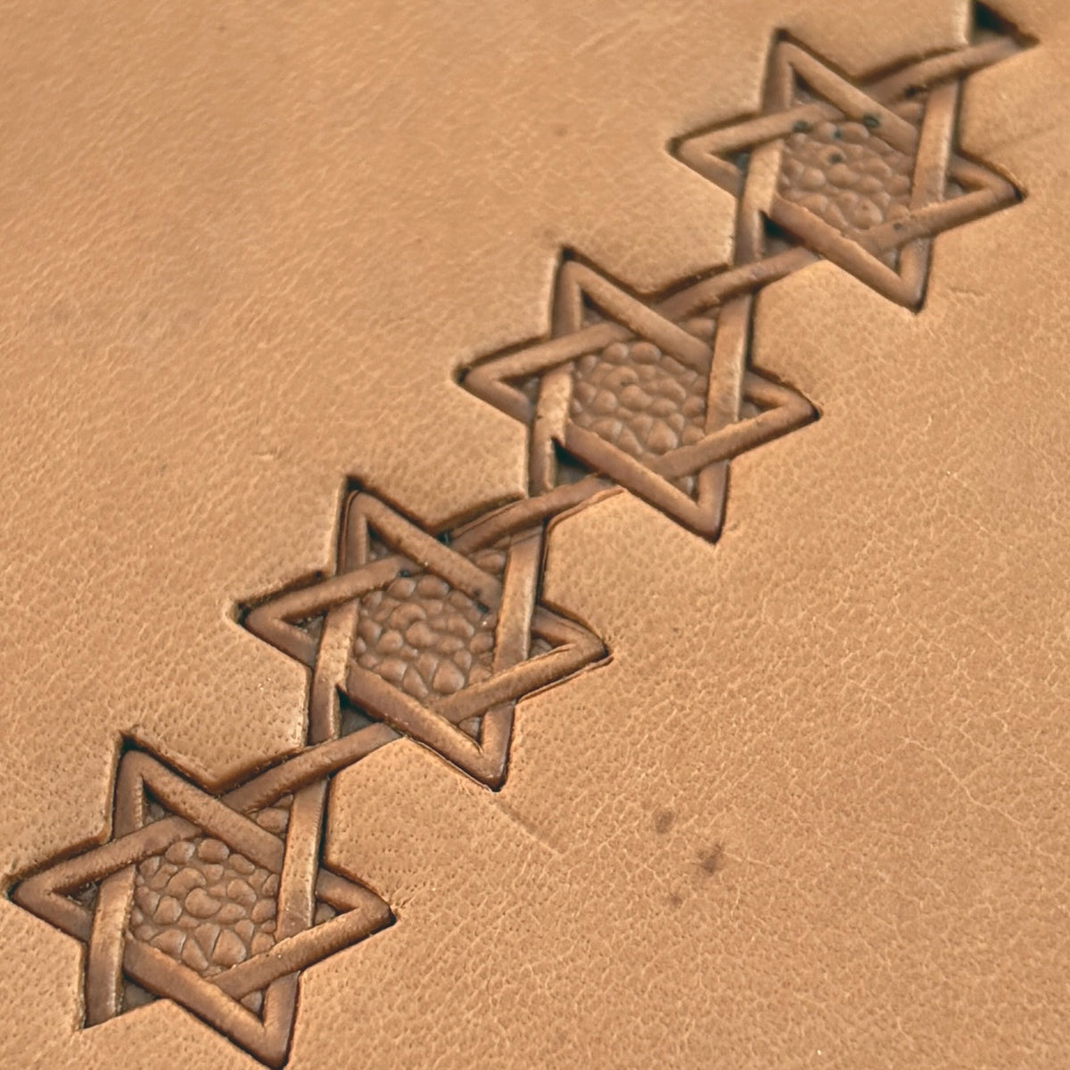 Interwoven Star Geometric leather stamp LT515 — pattern imprint on veg-tan leather
