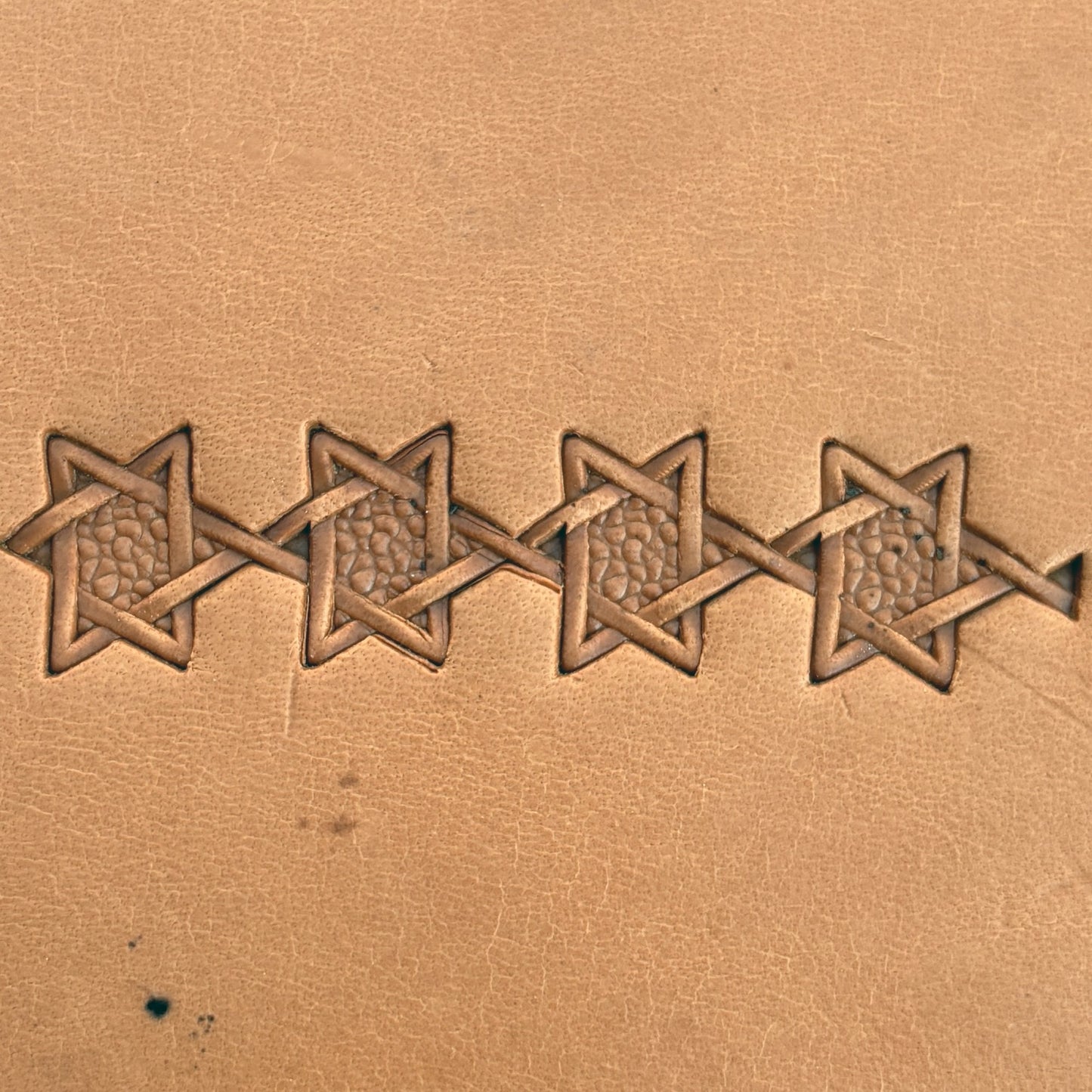 Interwoven Star Geometric leather stamp LT515 — pattern imprint on veg-tan leather