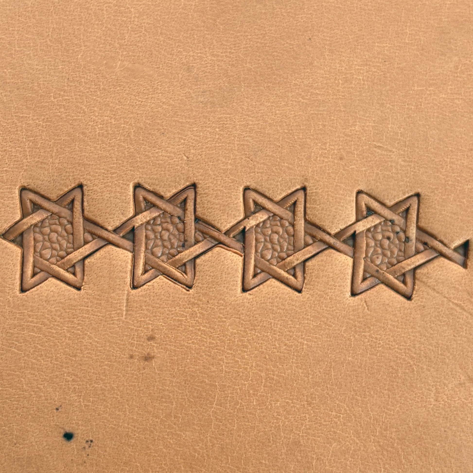 Interwoven Star Geometric leather stamp LT515 — pattern imprint on veg-tan leather