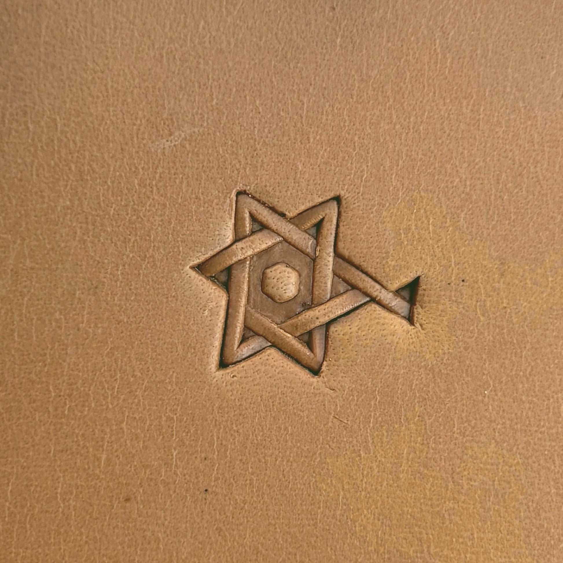 Interlocking Stars Geometric leather stamp LT516 — single impression on veg-tan leather