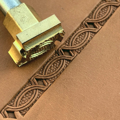 Interlinked Ovals Border Geometric leather stamp LT521 — brass stamping tool with imprint on natural veg-tan leather