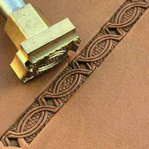 Interlinked Ovals Border Geometric leather stamp LT521 — brass stamping tool with imprint on natural veg-tan leather