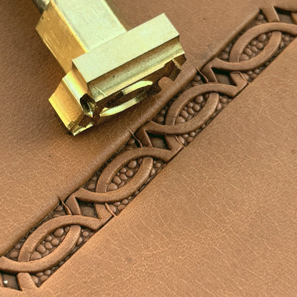 Oval Accent Border + Corner Geometric leather stamp LT522 — brass stamping tool with imprint on natural veg-tan leather