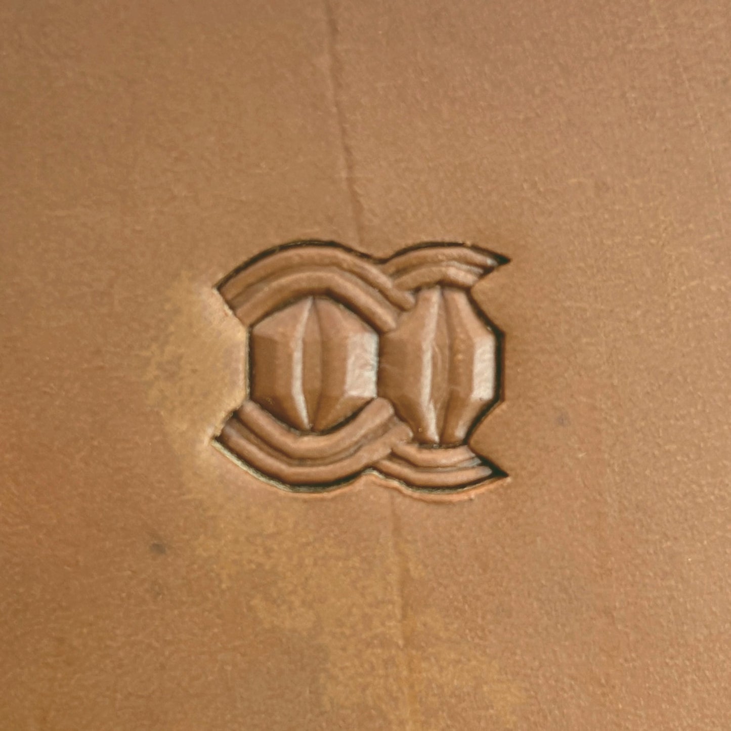 Interlock Geometric leather stamp LT525 — single impression on veg-tan leather