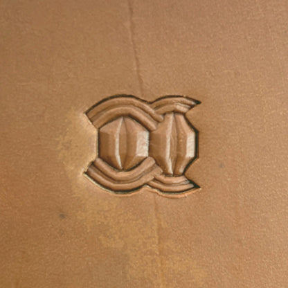 Interlock Geometric leather stamp LT525 — single impression on veg-tan leather